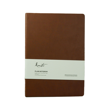 Karatis B5 notebook with golden brown cover featuring Tomoe River paper, showcasing a sleek, compact design ideal for writing.