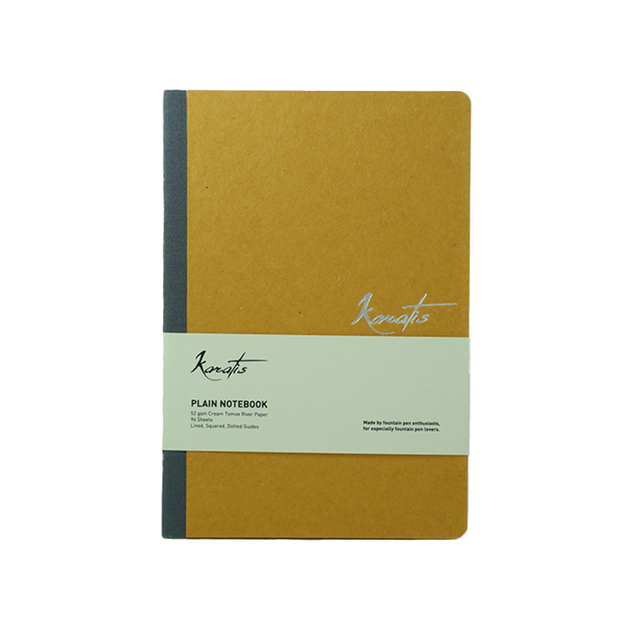 Yellow Karatis Amber notebook with Tomoe River paper, featuring a sleek cover and compact size for writing and note-taking.