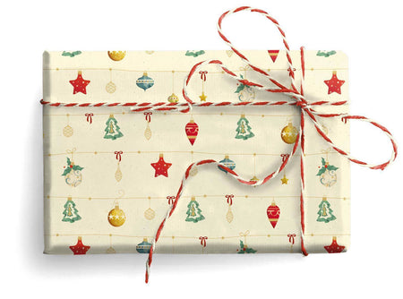 Kartos wrapping paper with little ornament patterns, featuring festive holiday designs on white background.