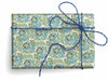Kartos wrapping paper featuring peacock feathers with vibrant blue and green colors, ideal for gift wrapping and decoration.