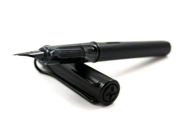 Lamy AL Star black fountain pen with extra-fine steel nib, sleek design, and modern look for smooth writing.