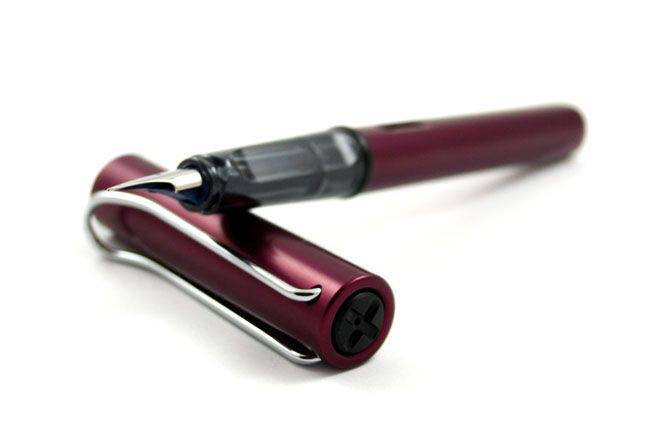 Black Lamy AL Star fountain pen with extra-fine steel nib, sleek design, and modern style for smooth writing.