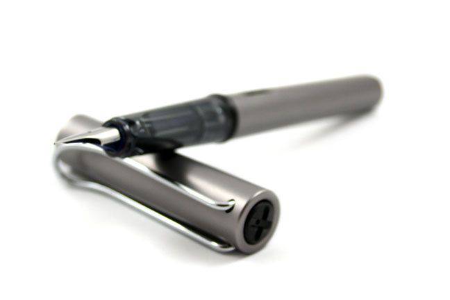 Lamy AL Star black fountain pen with extra-fine steel nib, sleek design, and ergonomic grip for smooth writing.