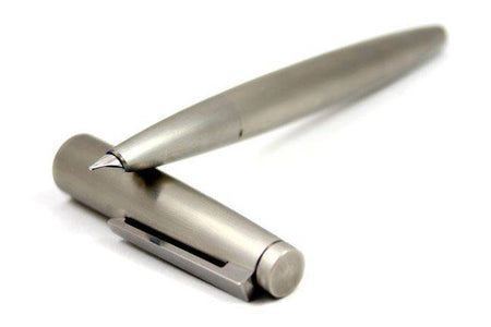 Lamy 2000 stainless steel fountain pen with gold trim and fine nib, showcasing its sleek design and premium craftsmanship.