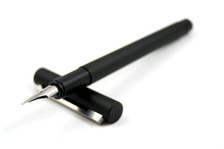Lamy CP1 black fountain pen with an extra-fine steel nib, showcasing the sleek design and smooth writing tip.