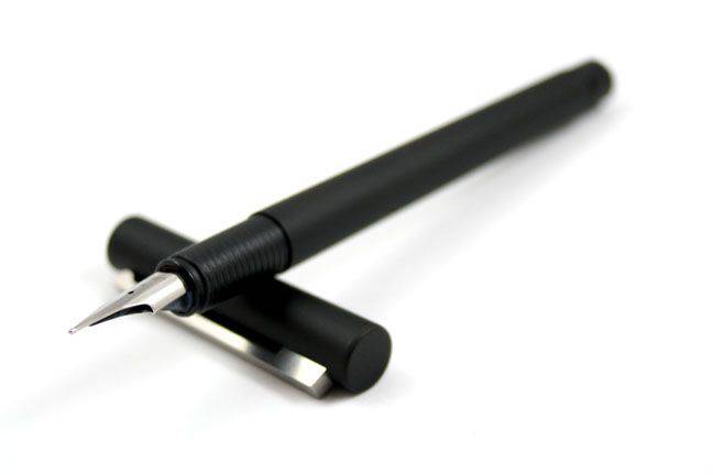 Lamy CP1 black fountain pen with an extra-fine steel nib, showcasing the sleek design and smooth writing tip.