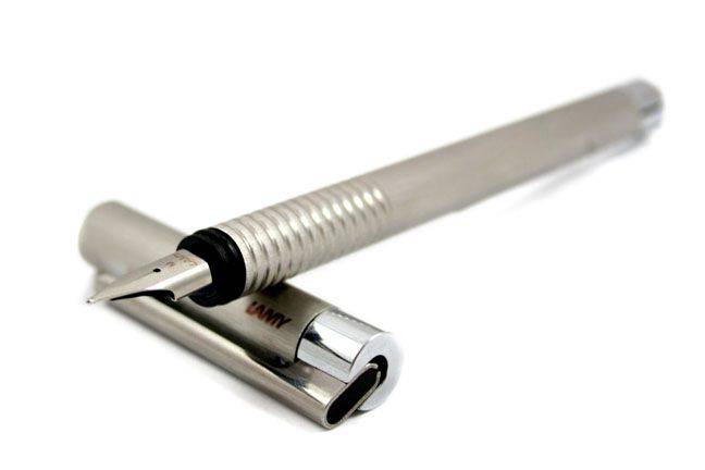 Lamy fountain pen with brushed steel finish and Lamy logo, featuring an extra-fine steel nib for smooth writing.