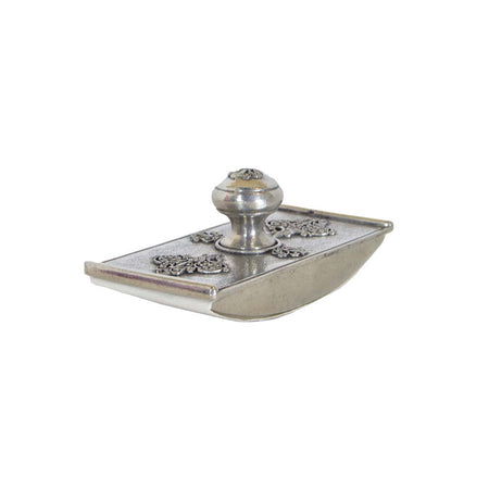 Le Potier D'etain filigree blotter with intricate metalwork design, used for absorbing ink or moisture on a desk.