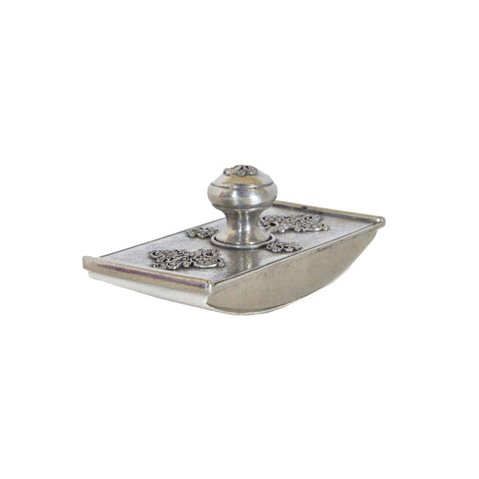Le Potier D'etain filigree blotter with intricate metalwork design, used for absorbing ink or moisture on a desk.