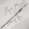 Le Potier D'etain pewter calligraphy dip pen with a fleur-de-lys design, ideal for elegant handwriting and artistic writing.