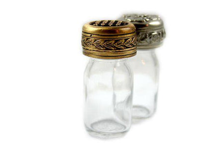 Bronze 10 ml ink bottle from Le Potier D'etain with a floral design, showcasing its elegant glass container.