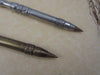 Le Potier d'Etain bronze ballpoint pen with quill tip and fleur de lys pattern, crafted in pewter or bronze finish.