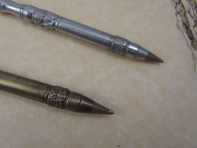 Le Potier d'Etain bronze ballpoint pen with quill tip and fleur de lys pattern, crafted in pewter or bronze finish.