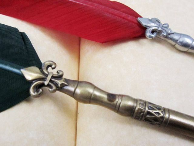 Le Potier d'Etain bronze ballpoint pen with quill tip and fleur de lys pattern, showcasing elegant pewter or bronze design.