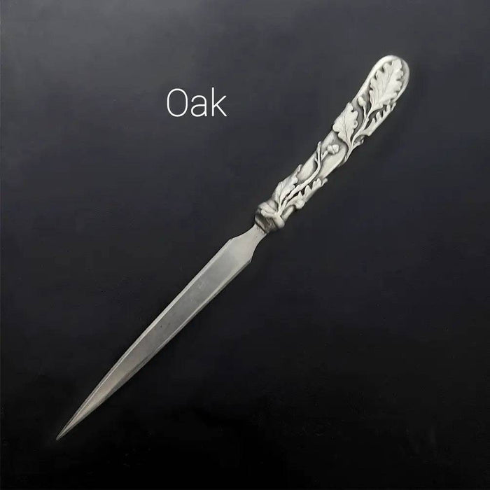 Le Potier D'Étain pewter letter opener with a feather design, crafted for elegant and easy envelope opening.