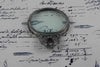 Large Le Potier D'etain magnifying glass with handle, featuring detailed acanthus design in pewter, ideal for close inspection.