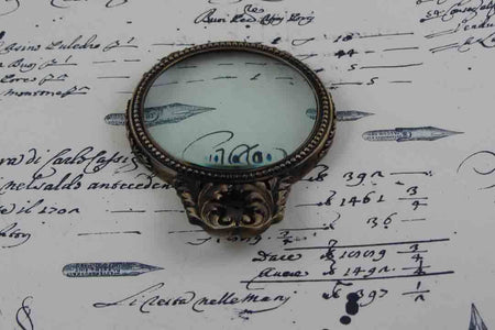 Le Potier D'Etain large pewter magnifying glass with handle and acanthus design, ideal for detailed viewing or decorative display.