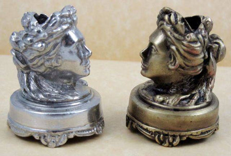 Pewter head-shaped pen rest by Le Potier D'etain, designed to hold writing pens on a desk or workspace.
