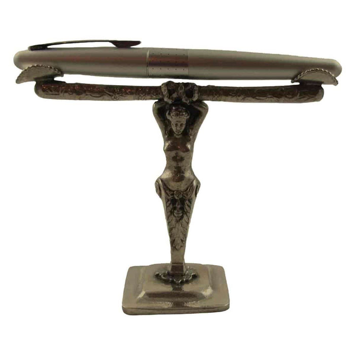 Le Potier D'Étain Goddess pewter pen holder resting on a desk, decorative pen rest with intricate goddess design.