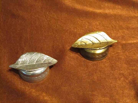Pewter leaf-shaped pen rest by Le Potier D'etain, decorative accessory for desk or writing area.