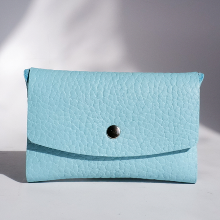 Light blue leather Swatch Book Card Holder by Papier Plume, compact leather card organizer with multiple slots for swatches.