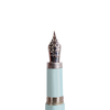 Light blue Jean-Pierre Lepine Yuzu fountain pen with gold accents on smooth nib, showcasing elegant writing instrument design.
