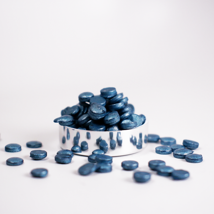 Metallic turquoise wax beads by Papier Plume, small round beads with a shiny, reflective finish for candle making or crafts.