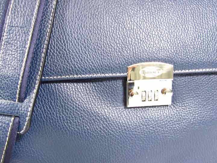 Blue Munari Granata leather briefcase with lock, featuring sturdy handles and sleek design for professional use.