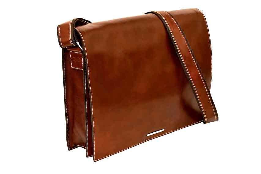 Dark brown Munari leather messenger bag with Vachetta leather accents, featuring a flap closure and adjustable shoulder strap.