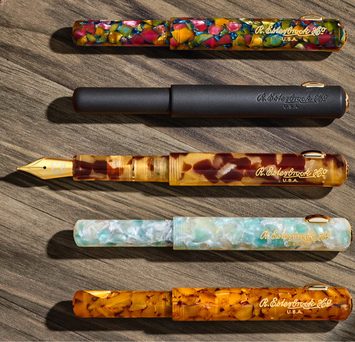 Esterbrook Niblet fountain pen with a sleek black body and gold accents, displayed on a white background.