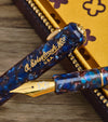 Esterbrook Niblet fountain pen with a sleek nib and smooth black body, showcasing its elegant design and fine writing tip.