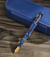 Esterbrook Niblet fountain pen with a sleek black body and gold accents, showcasing the pen's nib and elegant design.