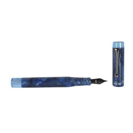 Opus 88 Sapphire Demo fountain pen with extra-fine nib, showcasing a sleek design and transparent body for the Opus88 brand.