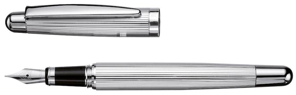 Otto Hutt Design 02 Pinstripe Fountain Pen with gold accents and fine nib, displaying its sleek black and gold striped design.