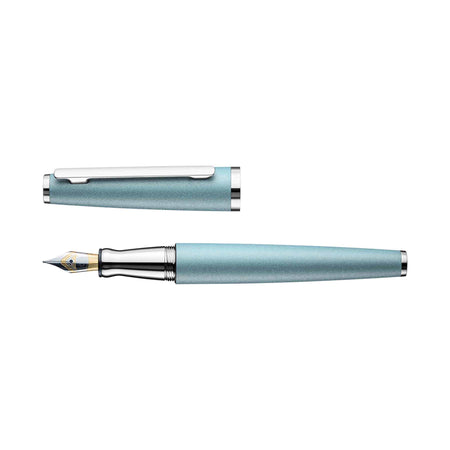 Otto Hutt Design 06 Arctic Blue fountain pen with fine nib, featuring sleek blue resin body and gold accents.