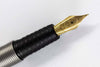 Otto Hutt Design 08 Ruthenium Plated Fountain Pen with fine nib, showcasing sleek metal finish and elegant design.
