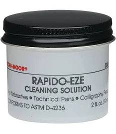 Papier Plume nib cleaner for calligraphy ink, shown with cleaning solution and brushes for maintaining calligraphy nibs.