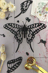 Black paper Swordtail Butterfly craft by Assembli, showcasing detailed paper wings and delicate design on a white background.