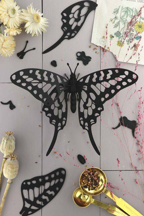 Black paper Swordtail Butterfly craft by Assembli, showcasing detailed paper wings and delicate design on a white background.