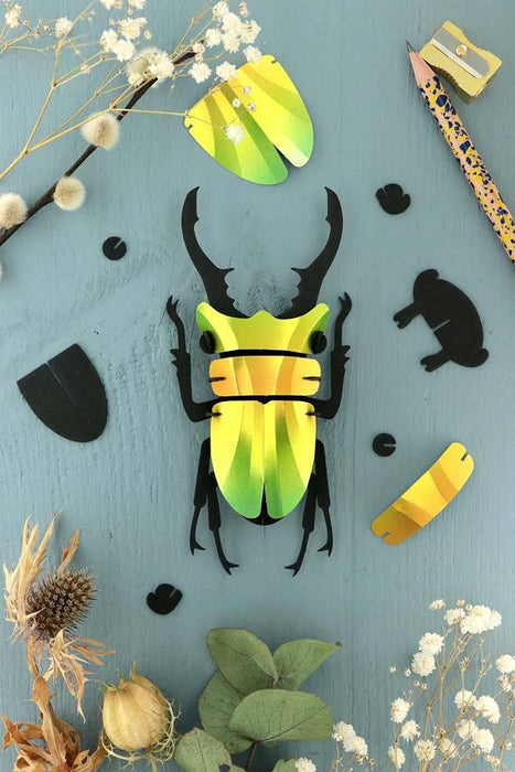 Small Paper Stag Beetle craft by Assembli in Caribbean green metal paper, featuring detailed wings and antennae.