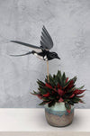Craft paper swallow by Assembli, featuring delicate, folded paper design for creative arts and crafts projects.