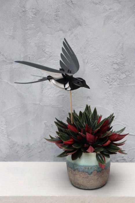 Craft paper swallow by Assembli, featuring delicate, folded paper design for creative arts and crafts projects.