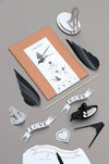 Paper Swallow craft by Assembli featuring a delicate paper swallow sculpture on a neutral background.