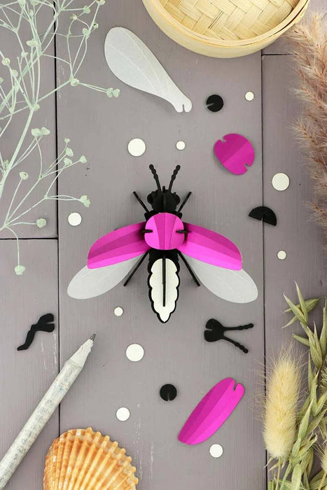 Emerald green metallic Paper Firefly craft made with Assembli's Papier Plume craft paper, showcasing a detailed firefly design.