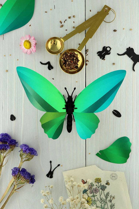 Glossy blue paper Birdwing Butterfly craft by Assembli, featuring vibrant azur blue wings and intricate paper details.