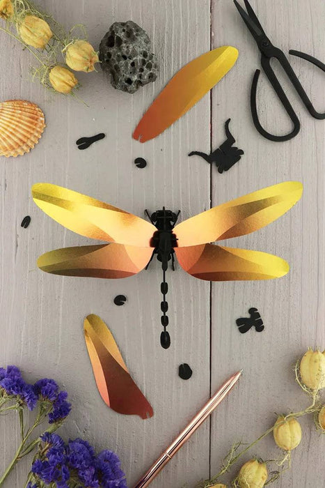 Glossy Caribbean green paper Anisoptera dragonfly craft by Assembli, featuring intricate paper wings and detailed body.