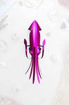 Pink paper crafts squid by Assembli, featuring detailed folds and creative design, perfect for DIY craft projects.