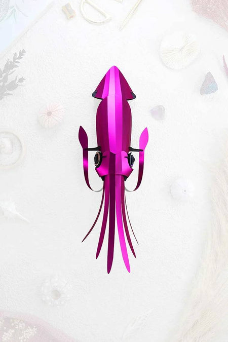 Pink paper crafts squid by Assembli, featuring detailed folds and creative design, perfect for DIY craft projects.
