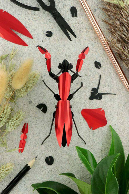 Assembli Paper Praying Mantis craft made from red metal and paper, showcasing detailed insect sculpture for arts and crafts projects.