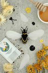 Gold satin paper craft of a honey bee made from Assembli Paper Honey Bee craft paper, showcasing detailed bee and wings.
